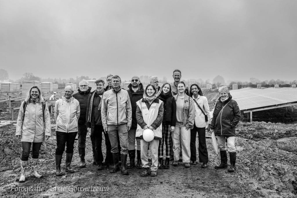 Group photo of attendees at Wijkerbroek Solar Park, discussing renewable energy initiatives and stakeholder participation